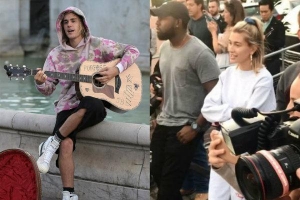 Justin Bieber vừa đệm đàn guitar vừa hát trên phố