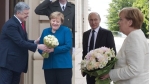 'Cuộc chiến hoa hồng' giữa ông Putin, Poroshenko và bà Merkel