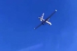 Tiêm kích Nga áp sát, lượn dưới bụng UAV Mỹ