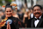 Trương Thị May mặc áo dài trên thảm đỏ Cannes, bị nhầm là siêu mẫu Nga