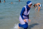 Hồ bơi Pháp đóng cửa vì phụ nữ mặc áo choàng xuống hồ