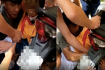 Nghẹt thở cảnh người dân chung sức giải cứu bé gái bị kẹt tay vào bánh xe do áo chống nắng