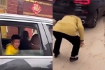 Sự thật bất ngờ clip cậu bé ném tiền từ trong ôtô xuống đất để người bà cúi nhặt