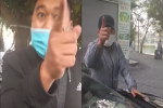 Giữa phố Hà Nội dọa đánh tài xế vì phí trông xe, 2 người đàn ông: 'Láo nháo ra đường'
