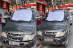Clip: Đậu xe chắn trước cửa hàng ở Hà Nội, ôtô bị dán giấy 'vô ý thức' và quấn băng dính chằng chịt