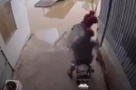 Camera ghi cảnh người mẹ thản nhiên bế con 1 tuổi quăng xuống sông