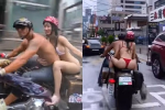 Cặp đôi ăn mặc hở tung như không mặc, lái xe máy tắm mưa, CDM tranh cãi dữ dội