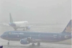 Miền Bắc chìm trong sương mù, nhiều chuyến bay bị hủy, chuyển hướng